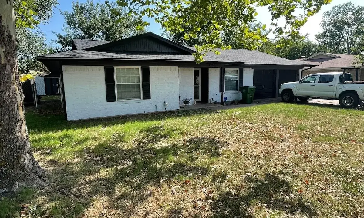 Professional roofing crew working on a residential roof in Lighthouse Point